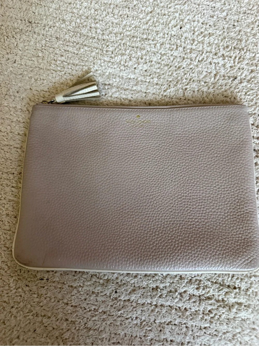 Kate Spade pebbled leather tassel clutch/pouch in light beige